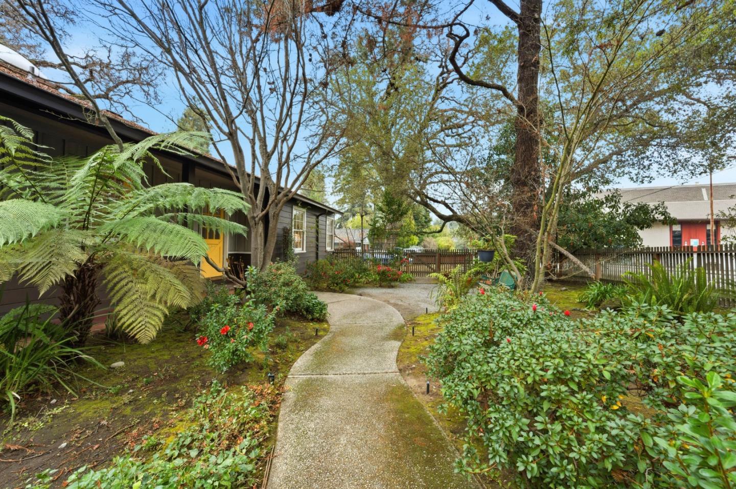 1698 Cordilleras Road Redwood City, CA 94062 - Photo 2 of 44 a backyard of a house with lots of green space