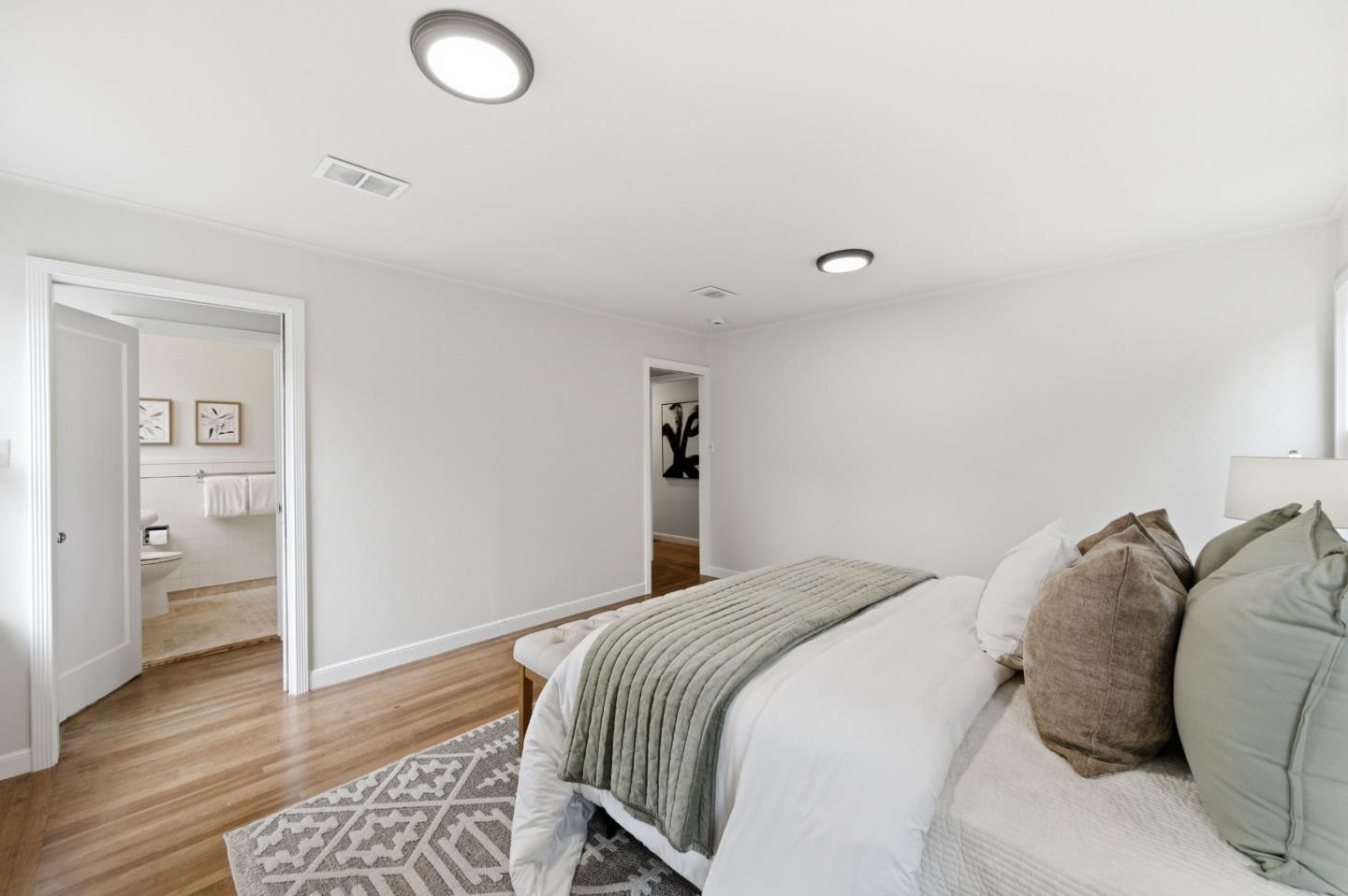 1698 Cordilleras Road Redwood City, CA 94062 - Photo 21 of 44 a bedroom with a bed and wooden floor