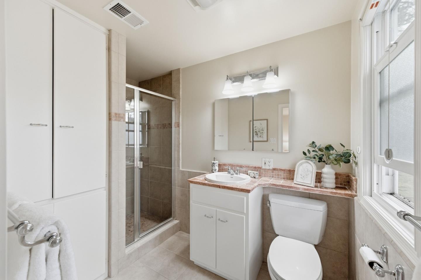 1698 Cordilleras Road Redwood City, CA 94062 - Photo 22 of 44 a bathroom with a granite countertop sink toilet and shower