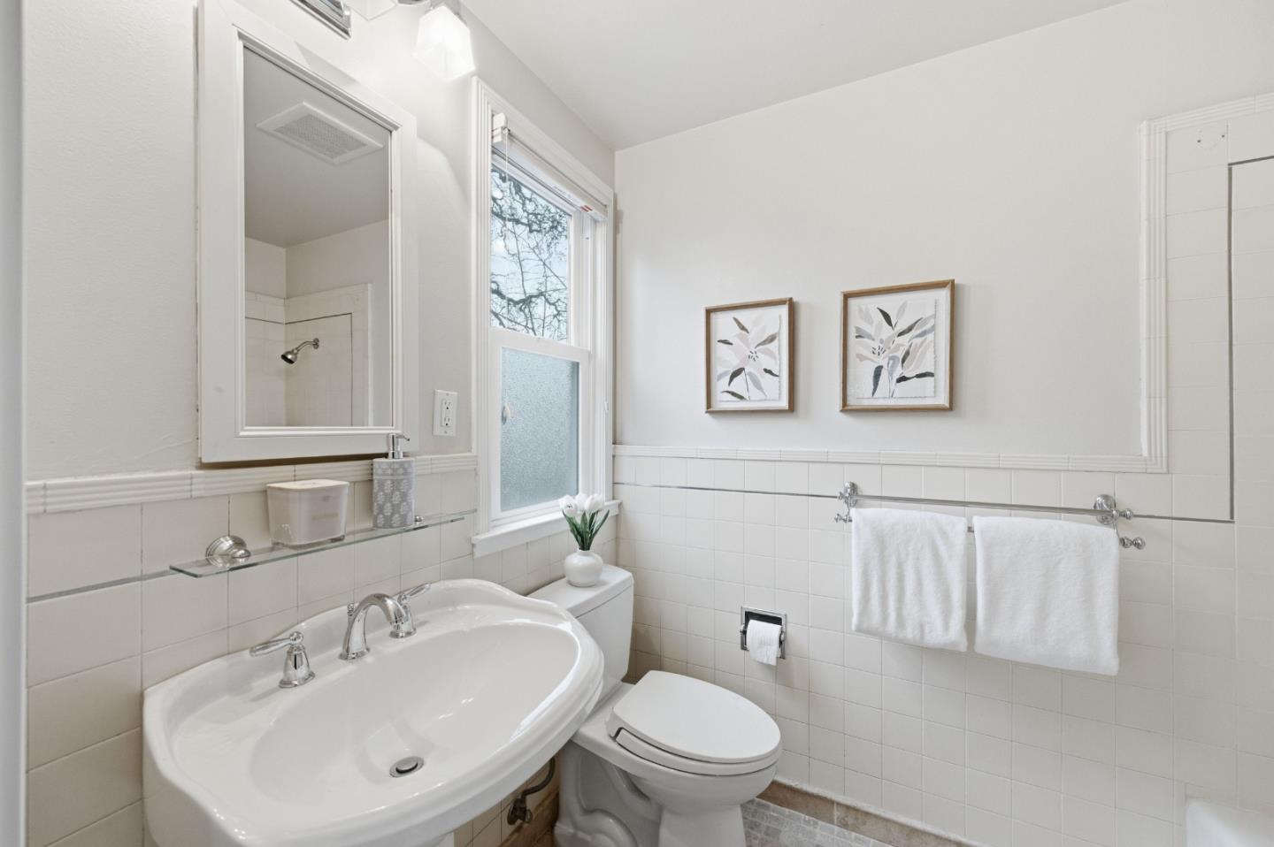 1698 Cordilleras Road Redwood City, CA 94062 - Photo 23 of 44 a bathroom with a toilet a sink and mirror