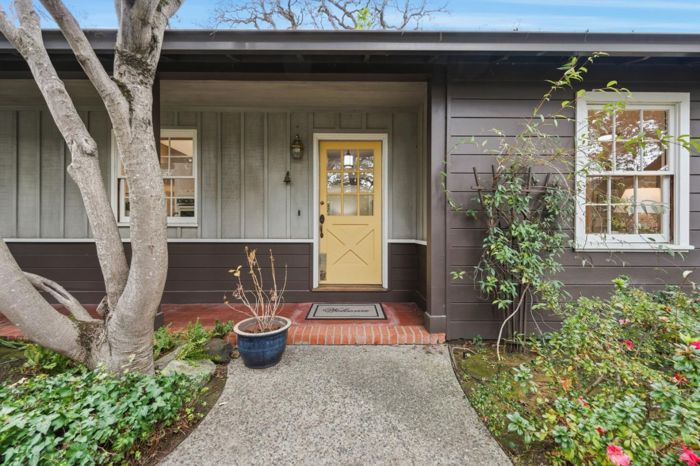 1698 Cordilleras Road Redwood City, CA 94062 - Photo 3 of 44 a front view of a house with garden