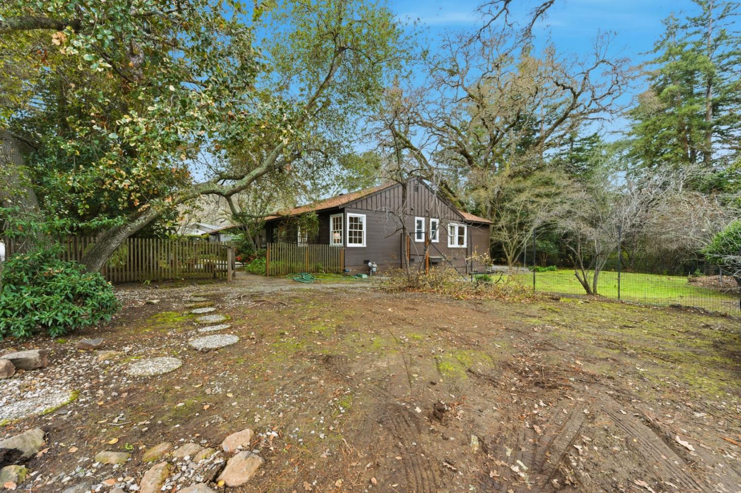 1698 Cordilleras Road Redwood City, CA 94062 - Photo 38 of 44 a house with trees in the background