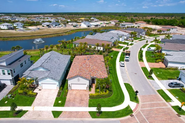 an aerial view of residential houses with outdoor space
