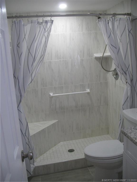5393 Southeast Miles Grant Road, Unit A103 Stuart, FL 34997 - Photo 10 of 20 Guest Sower Stall & Tub