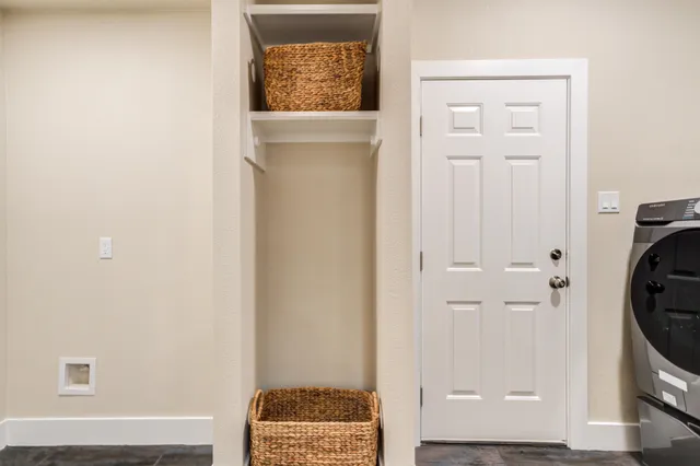 a view of bathroom with toilet and a window