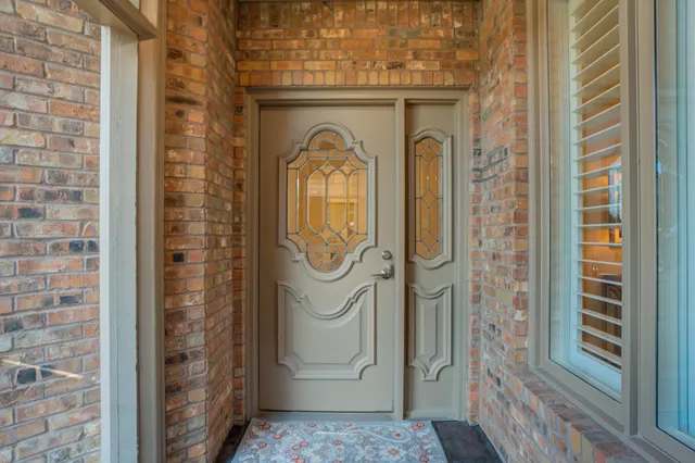 a glass door with a glass door shower