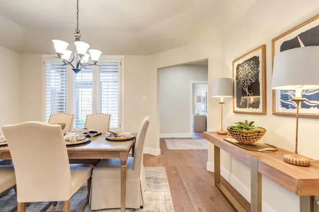 a dining room with furniture and window