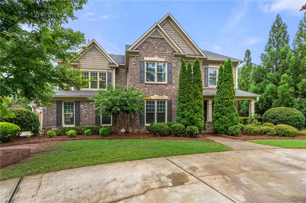 628 Tarpley Road Northwest Kennesaw, GA 30152 - Photo 1 of 1 a front view of a house with a yard