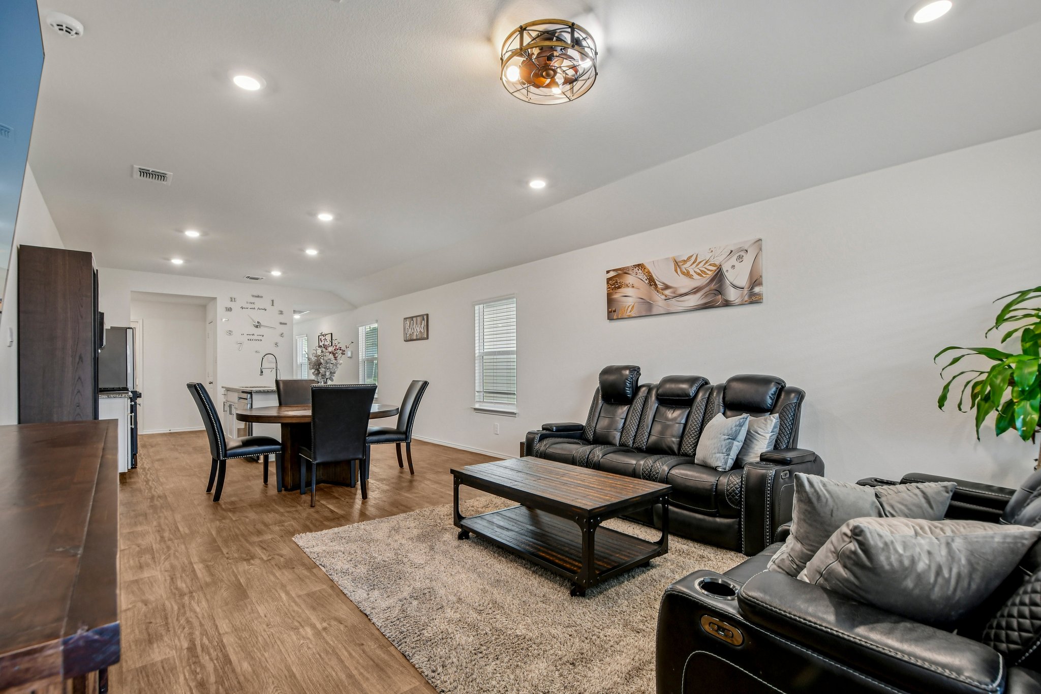 519 Sandringham Loop Kyle, TX 78640 - Photo 6 of 32 Living area featuring recessed lighting, wood finished floors, and lofted ceiling