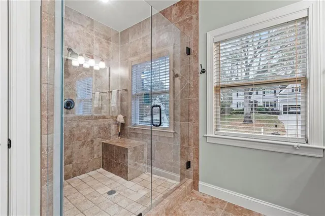a bathroom with a shower and a sink
