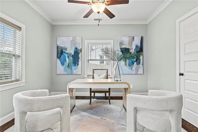 a living room with furniture a table and a painting