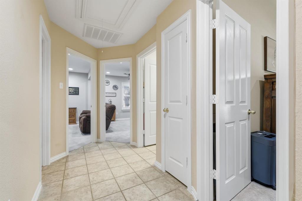 2012 Hayden Lane Corinth, TX 76210 - Photo 23 of 40 a view of a hallway with closet and bathroom