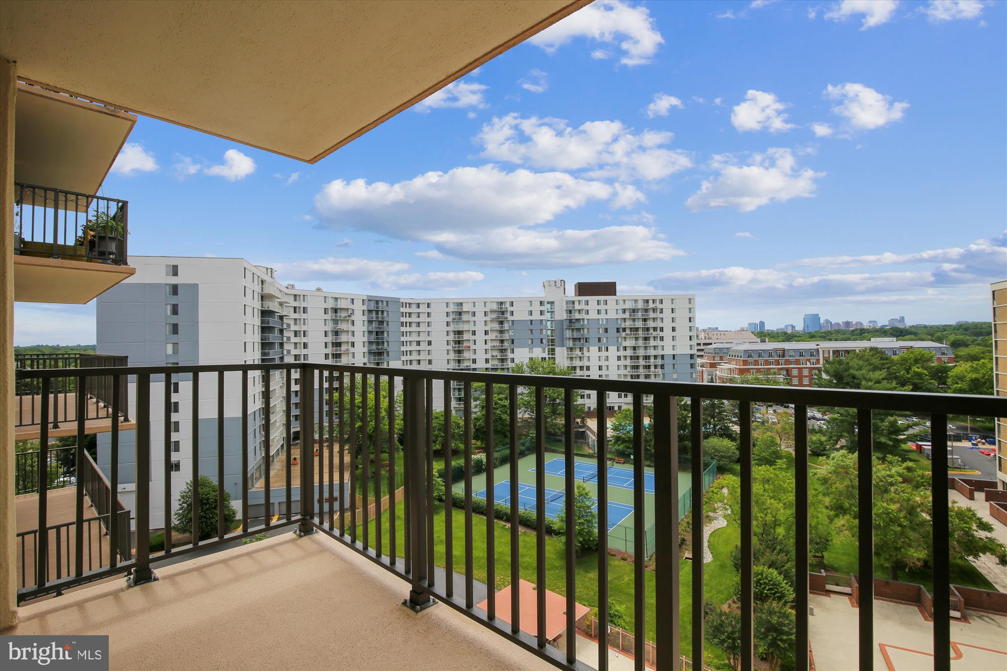 6800 Fleetwood Road, Unit 1004 McLean, VA 22101 - Photo 20 of 40 Scenic balcony view with urban greenery.