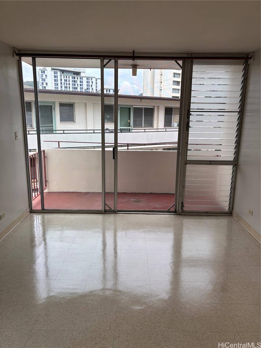 810 University Avenue, Unit 303 Honolulu, HI 96826 - Photo 3 of 12 a view of a refrigerator in kitchen and a window