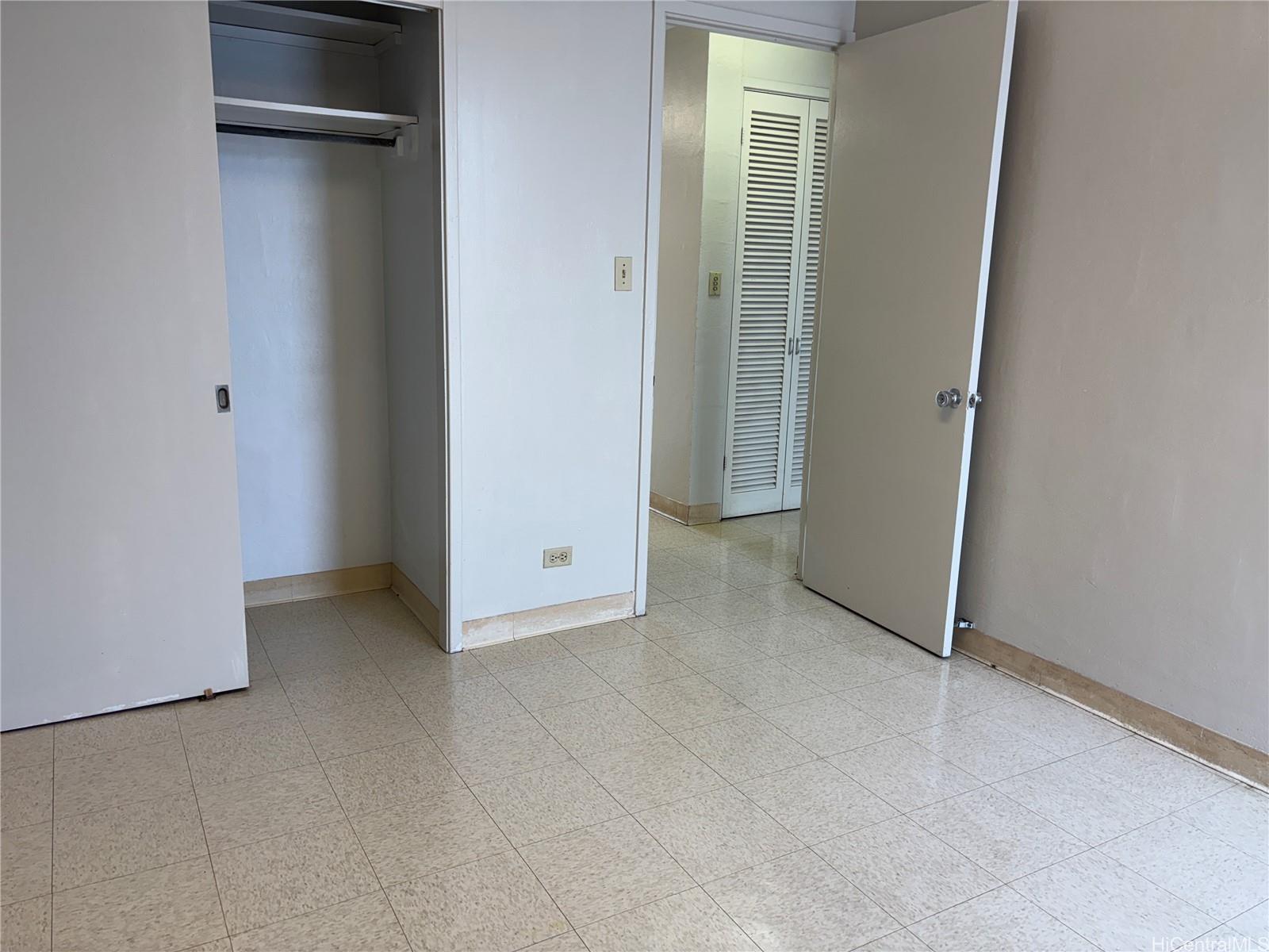 810 University Avenue, Unit 303 Honolulu, HI 96826 - Photo 7 of 12 an empty room with windows