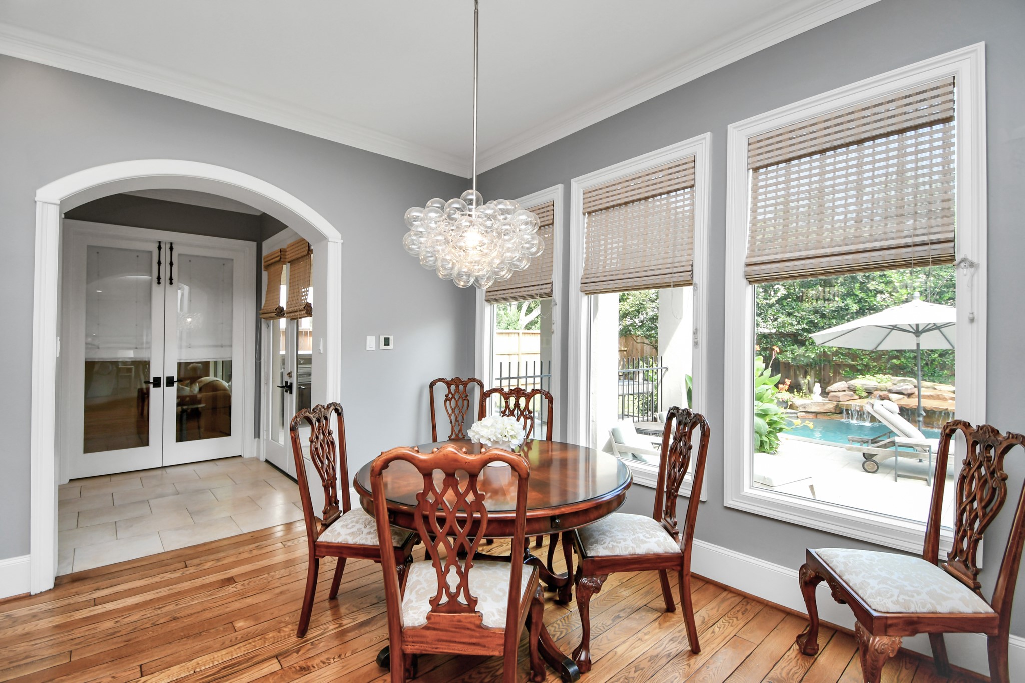 3739 Westerman Street Houston, TX 77005 - Photo 15 of 44 Off the kitchen is a full bathroom and flex room that could be used as a bedroom, currently used as a pool / exercise room. Double doors lead out to the covered patio and green space.