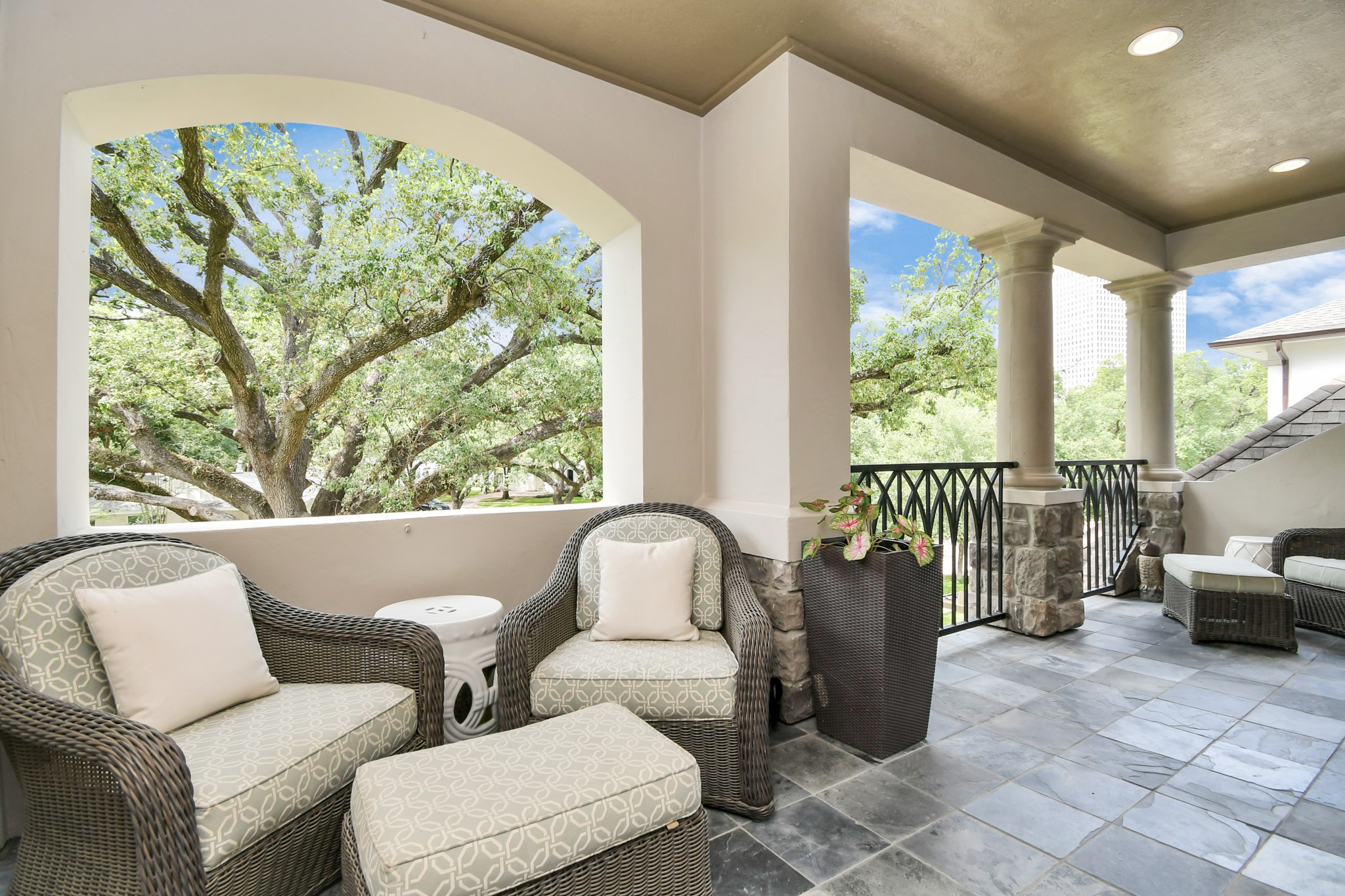 3739 Westerman Street Houston, TX 77005 - Photo 20 of 44 Front upstairs patio that overlooks the beautiful tree-lined street. Access to the balcony is from the primary suite as well as the hallway.