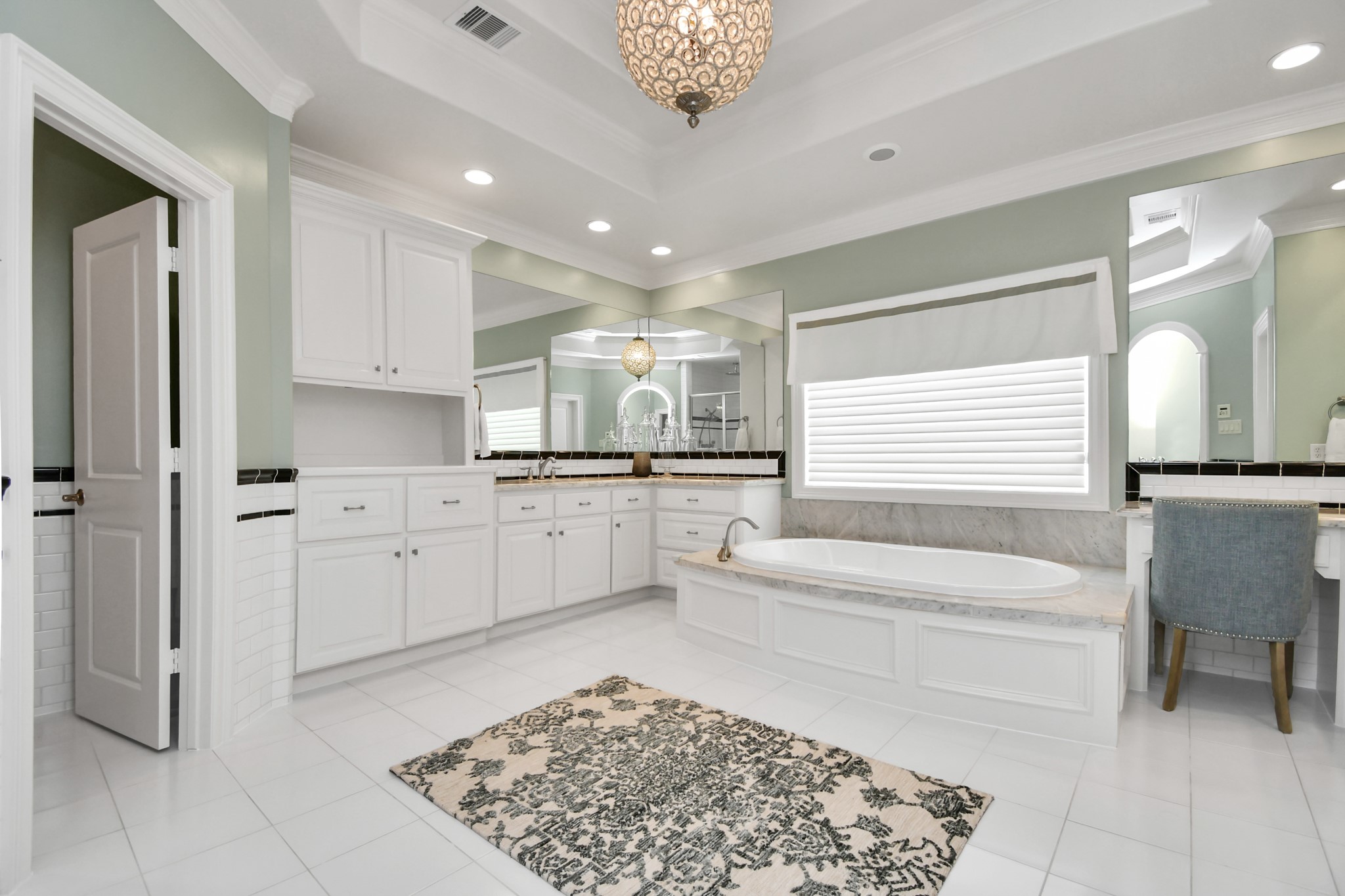 3739 Westerman Street Houston, TX 77005 - Photo 24 of 44 Indulge in the spa-like primary bath, featuring dual sinks, a separate vanity, a soaking tub, a walk-in shower, and a private water closet.