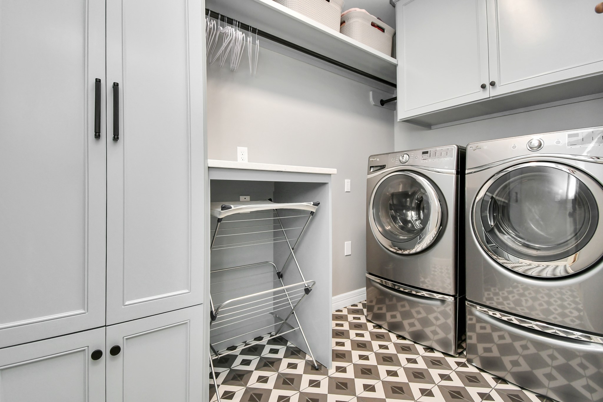 3739 Westerman Street Houston, TX 77005 - Photo 33 of 44 Recently updated and reconfigured laundry room with ample storage for cleaning supplies and linens.