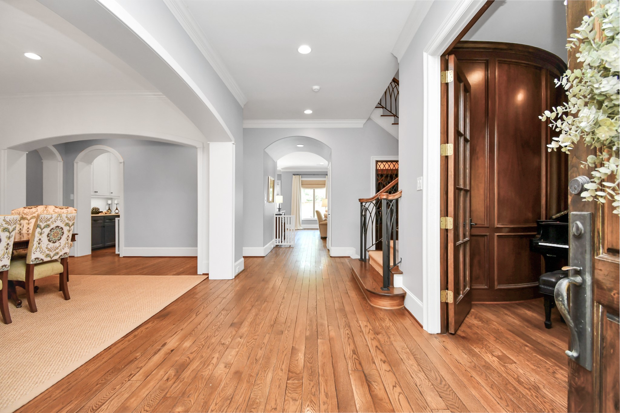 3739 Westerman Street Houston, TX 77005 - Photo 4 of 44 Grand entry with wide hallways with a view to the back of the house and the sparkling pool! Formal dining room on the left, wood-paneled office with french doors on the right.