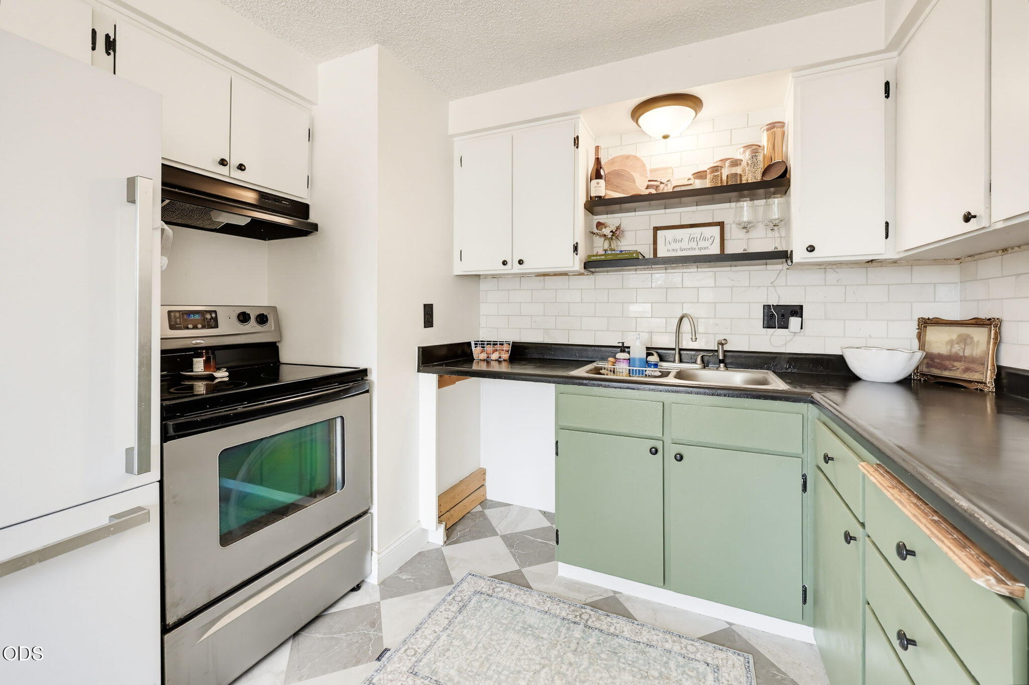 1325 Spring Street Medford, OR 97504 - Photo 3 of 27 a kitchen with stainless steel appliances granite countertop a sink a stove and cabinets