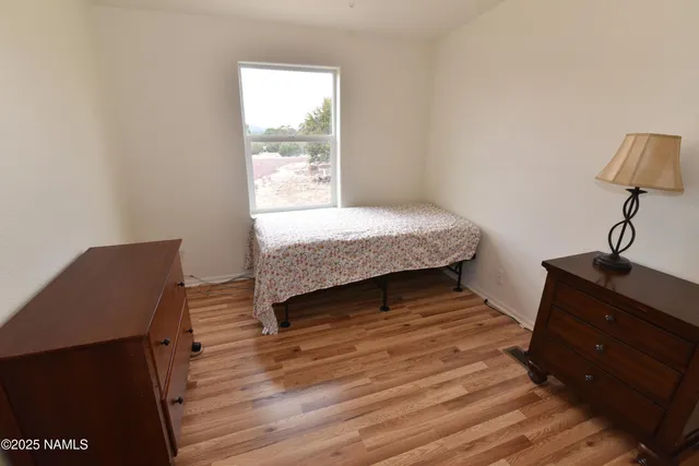 a room with a bed and a window