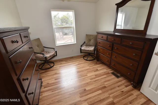 a view of an empty room with windows