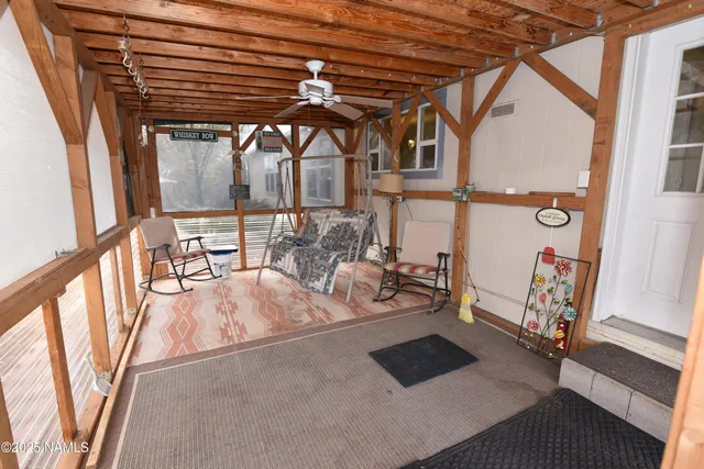 a view of living room with furniture and large window