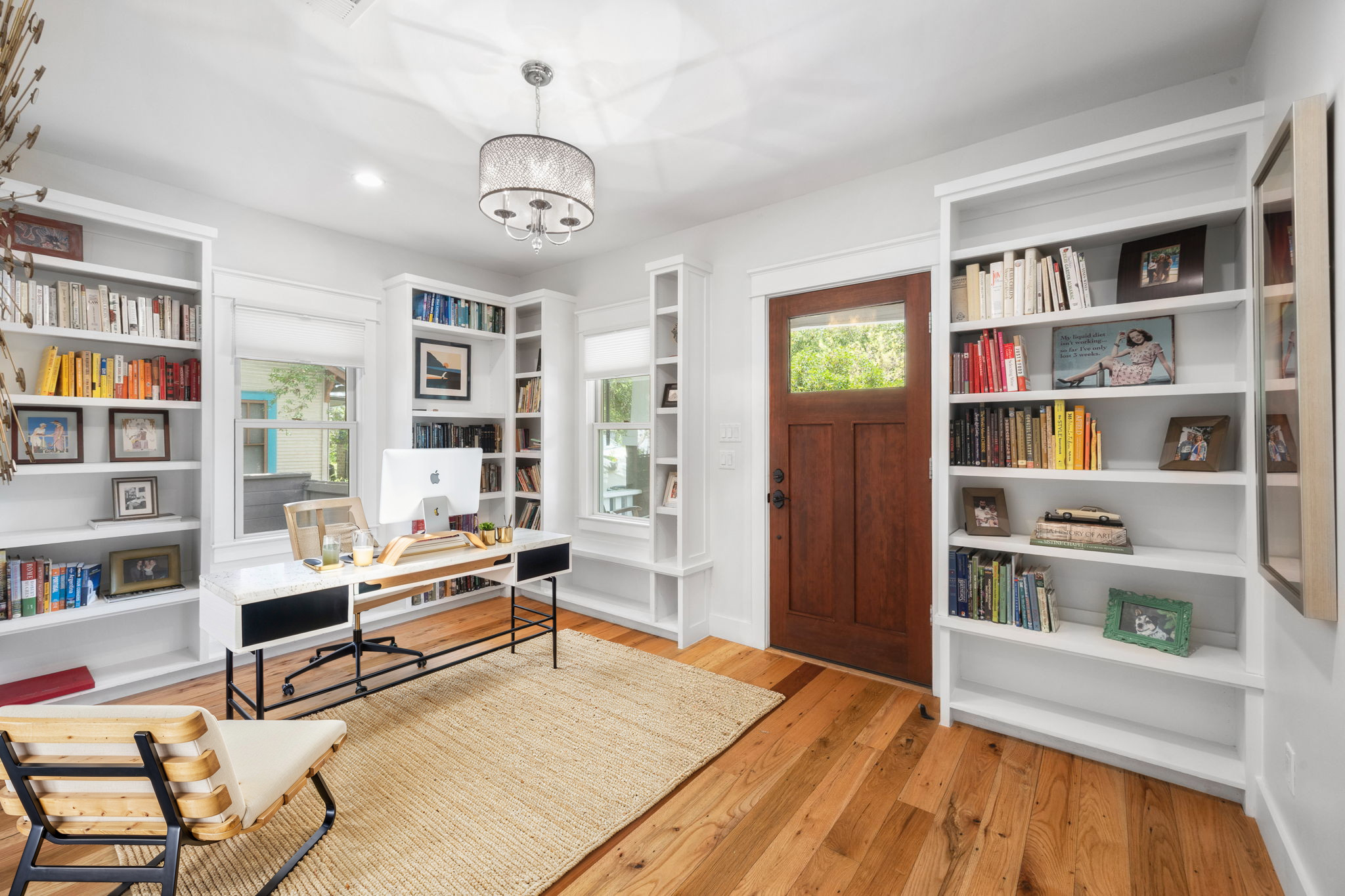 606 East 42nd Street Austin, TX 78751 - Photo 11 of 40 a living room with furniture and a book shelf