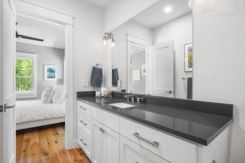 a en suite bathroom with double sink and a mirror