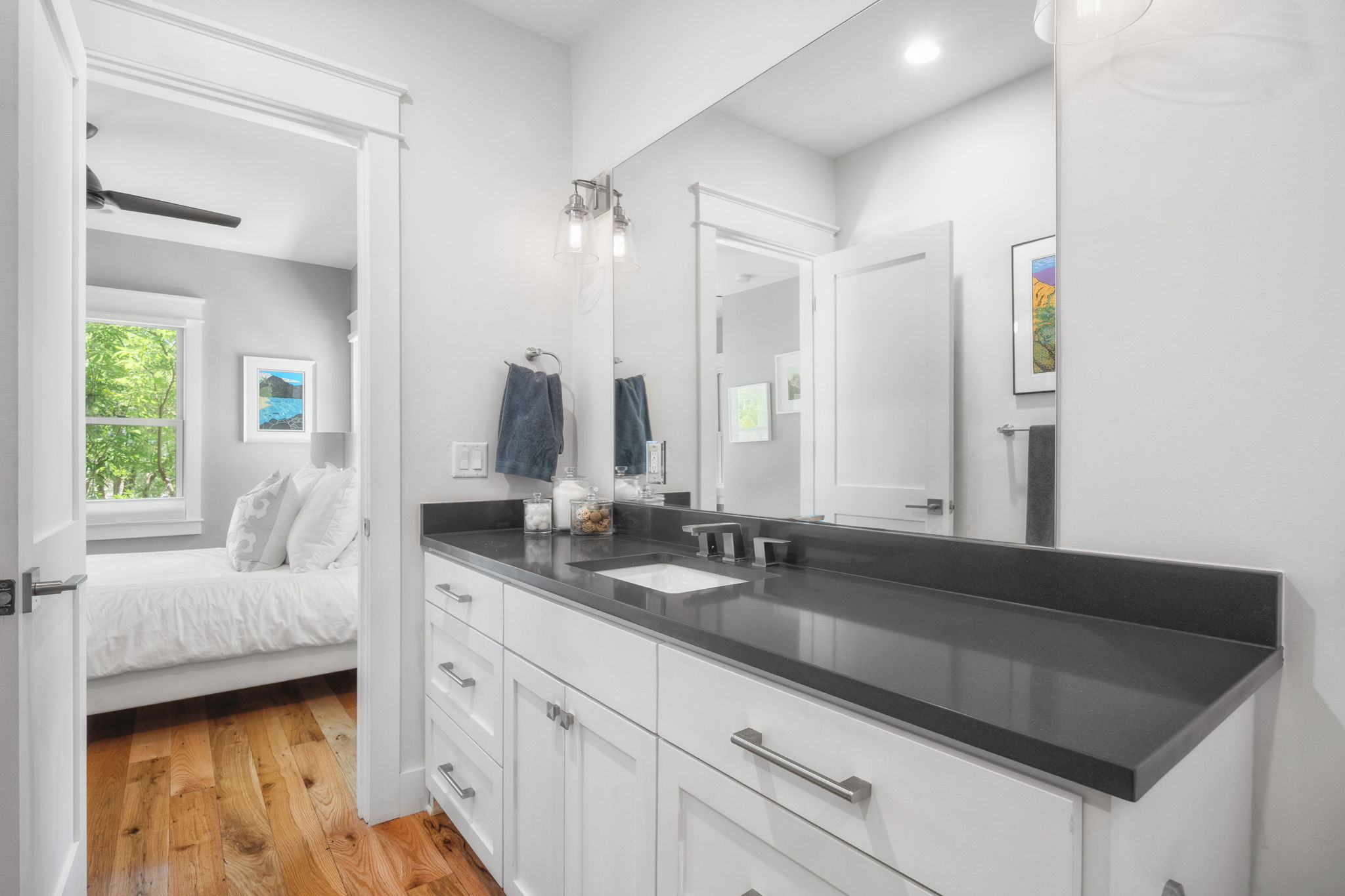 606 East 42nd Street Austin, TX 78751 - Photo 15 of 40 a en suite bathroom with double sink and a mirror