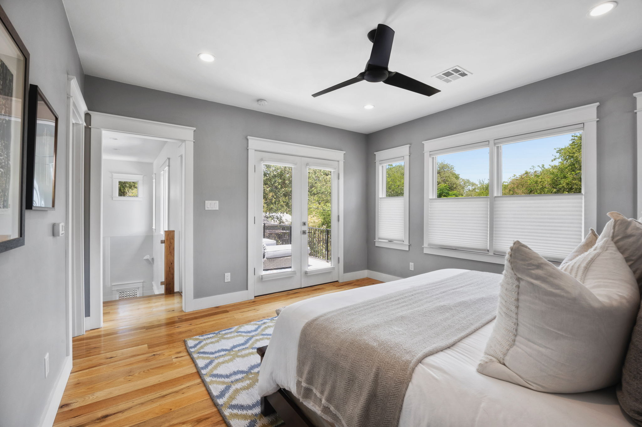 606 East 42nd Street Austin, TX 78751 - Photo 24 of 40 a bedroom with a large bed and a large window