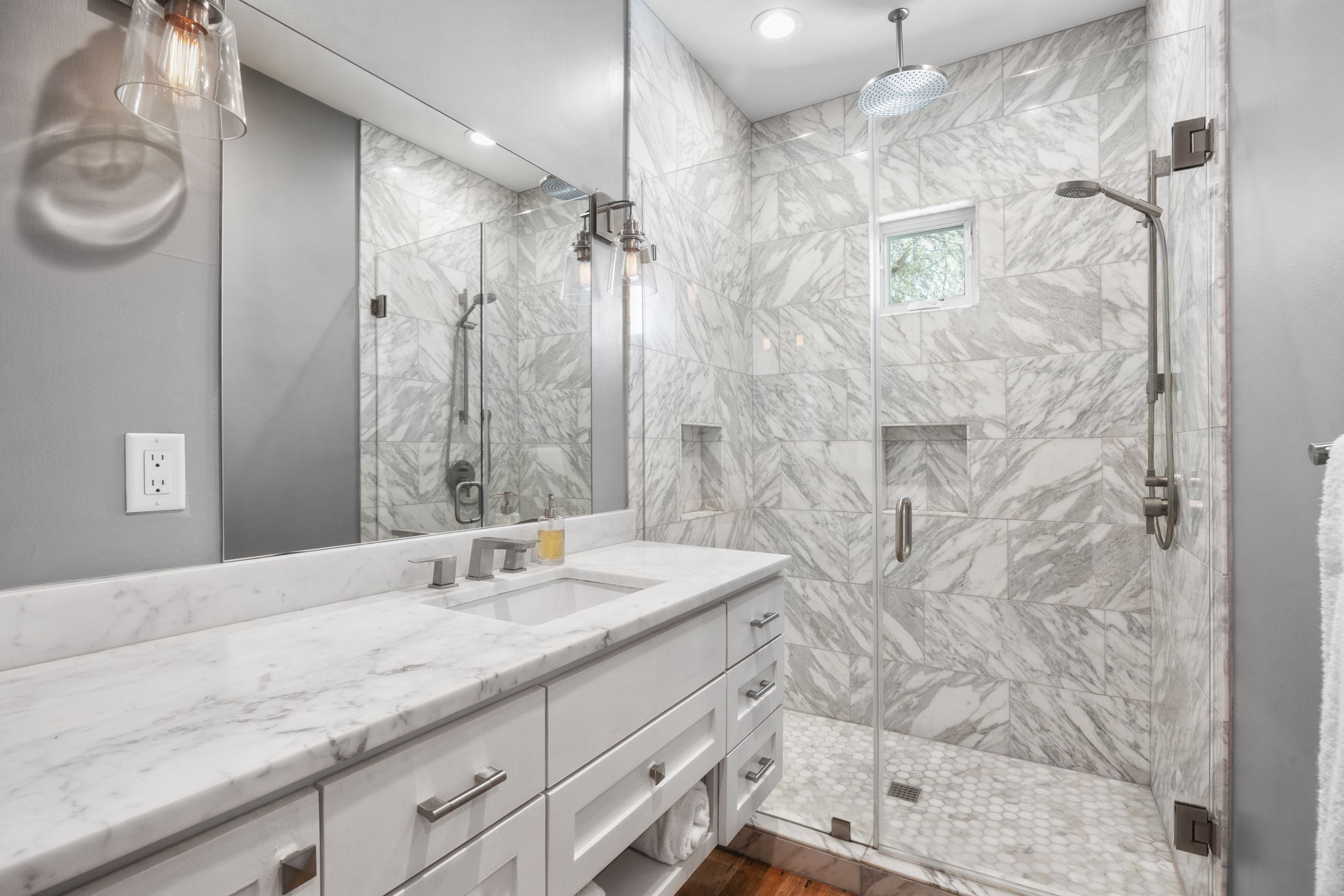 606 East 42nd Street Austin, TX 78751 - Photo 27 of 40 a bathroom with a granite countertop sink a mirror and shower