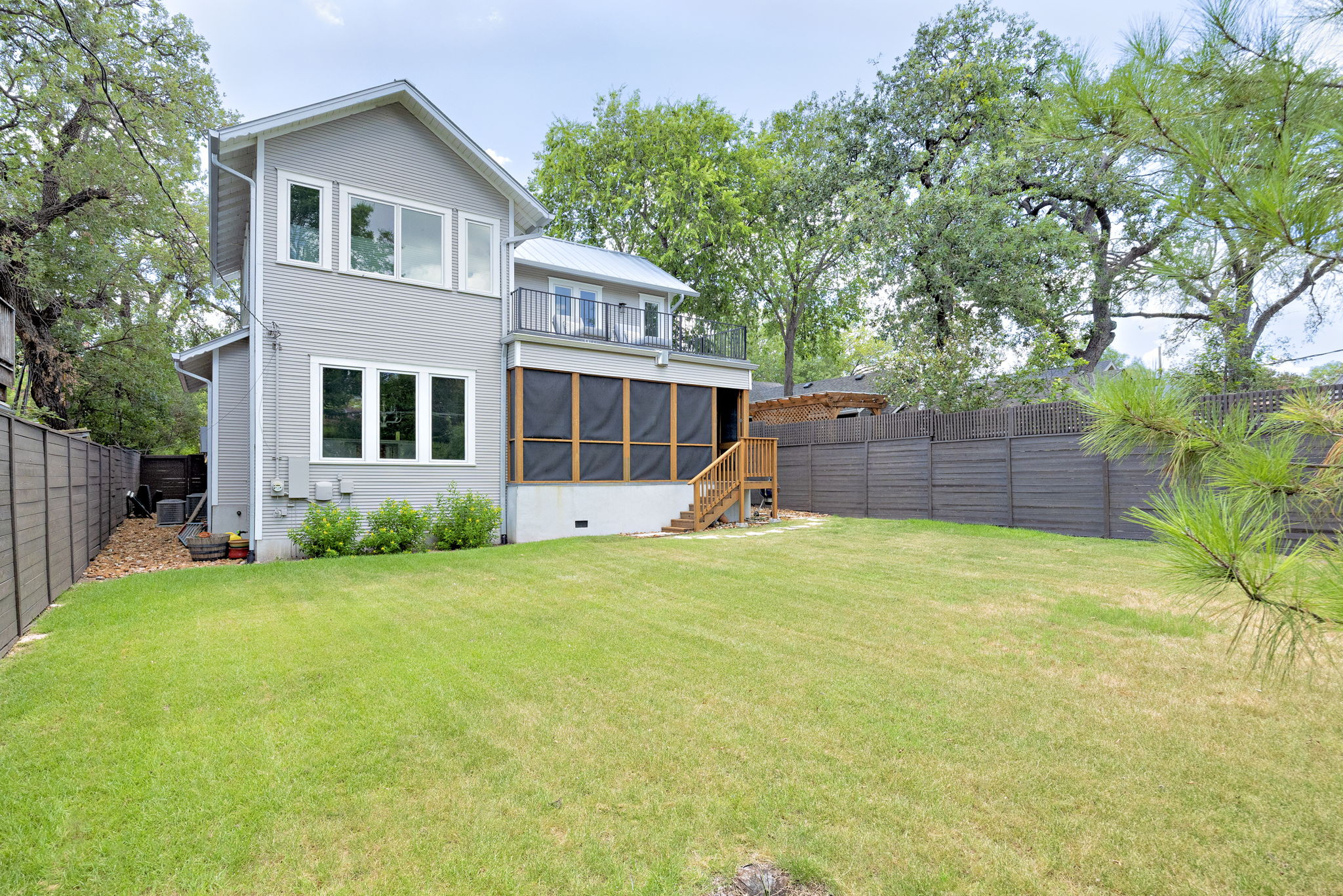 606 East 42nd Street Austin, TX 78751 - Photo 30 of 40 a front view of a house with a yard and trees