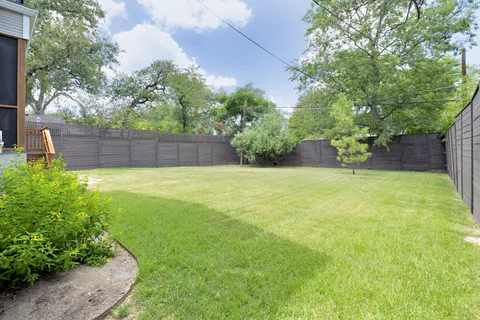 a view of a backyard with a small cabin