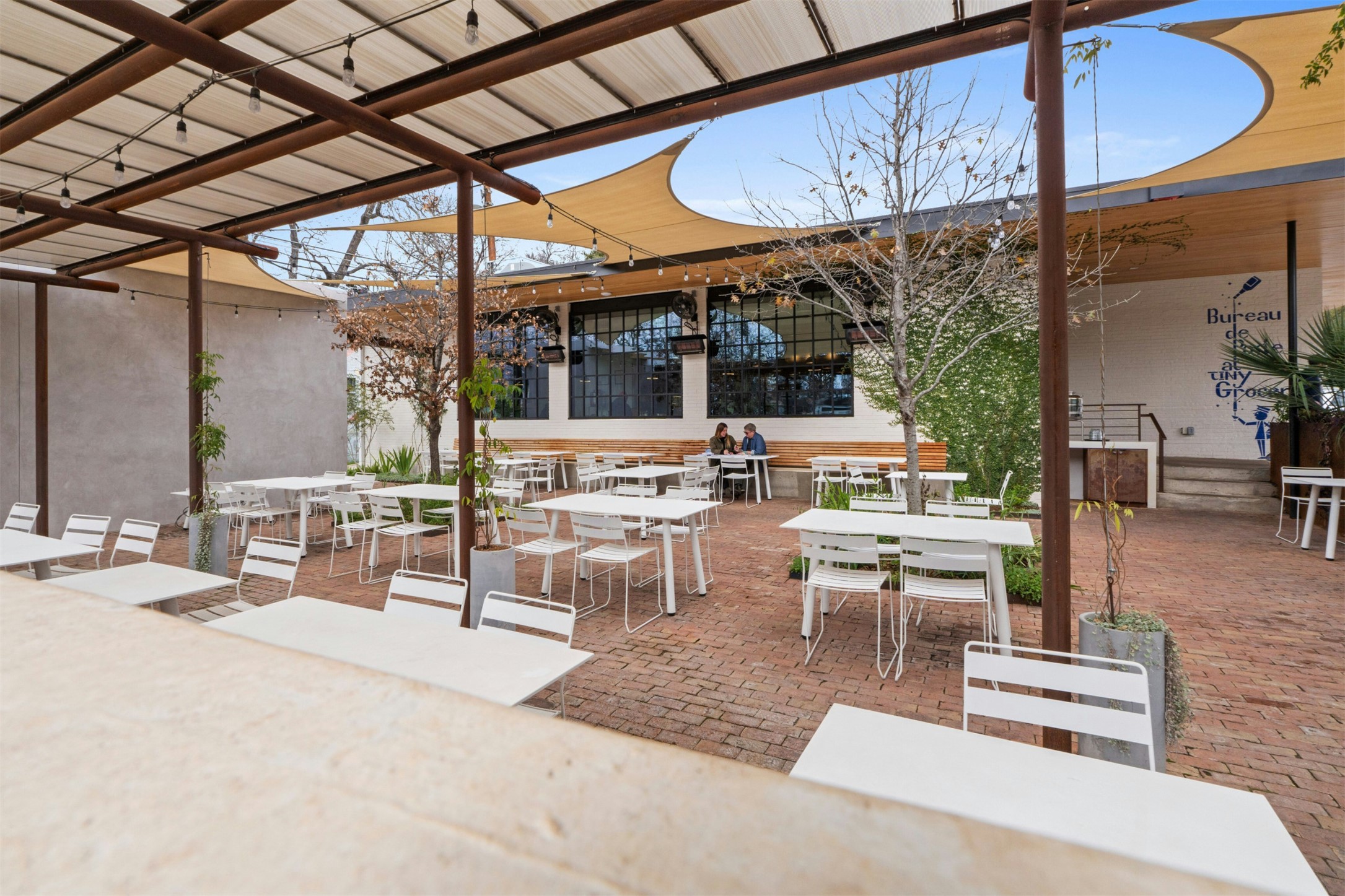606 East 42nd Street Austin, TX 78751 - Photo 35 of 40 a view of a patio with a table and chairs and potted plants