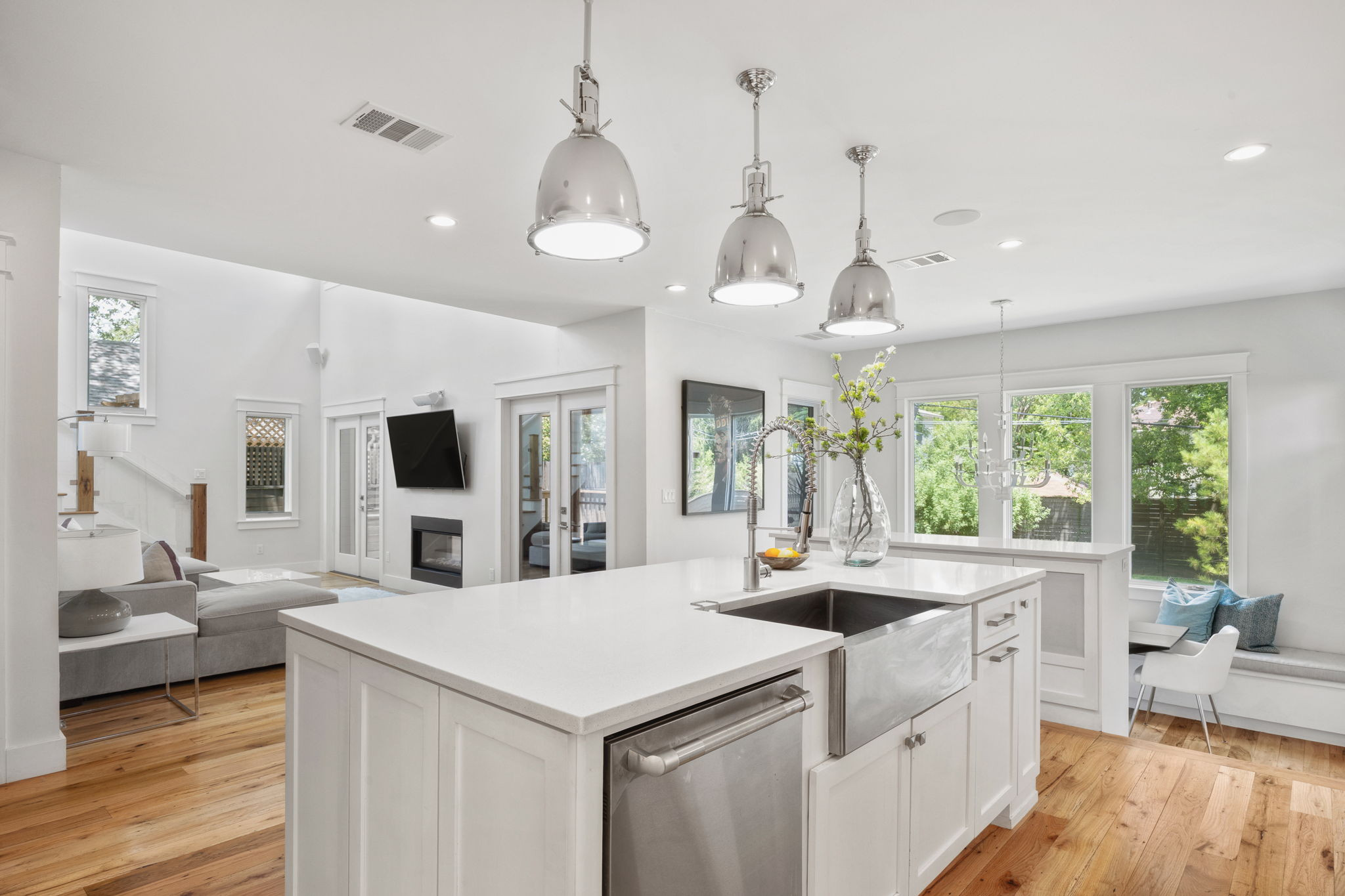 606 East 42nd Street Austin, TX 78751 - Photo 7 of 40 a large white kitchen with a large window and stainless steel appliances
