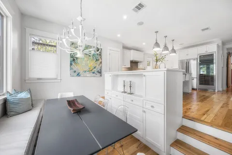 a kitchen with cabinets and window