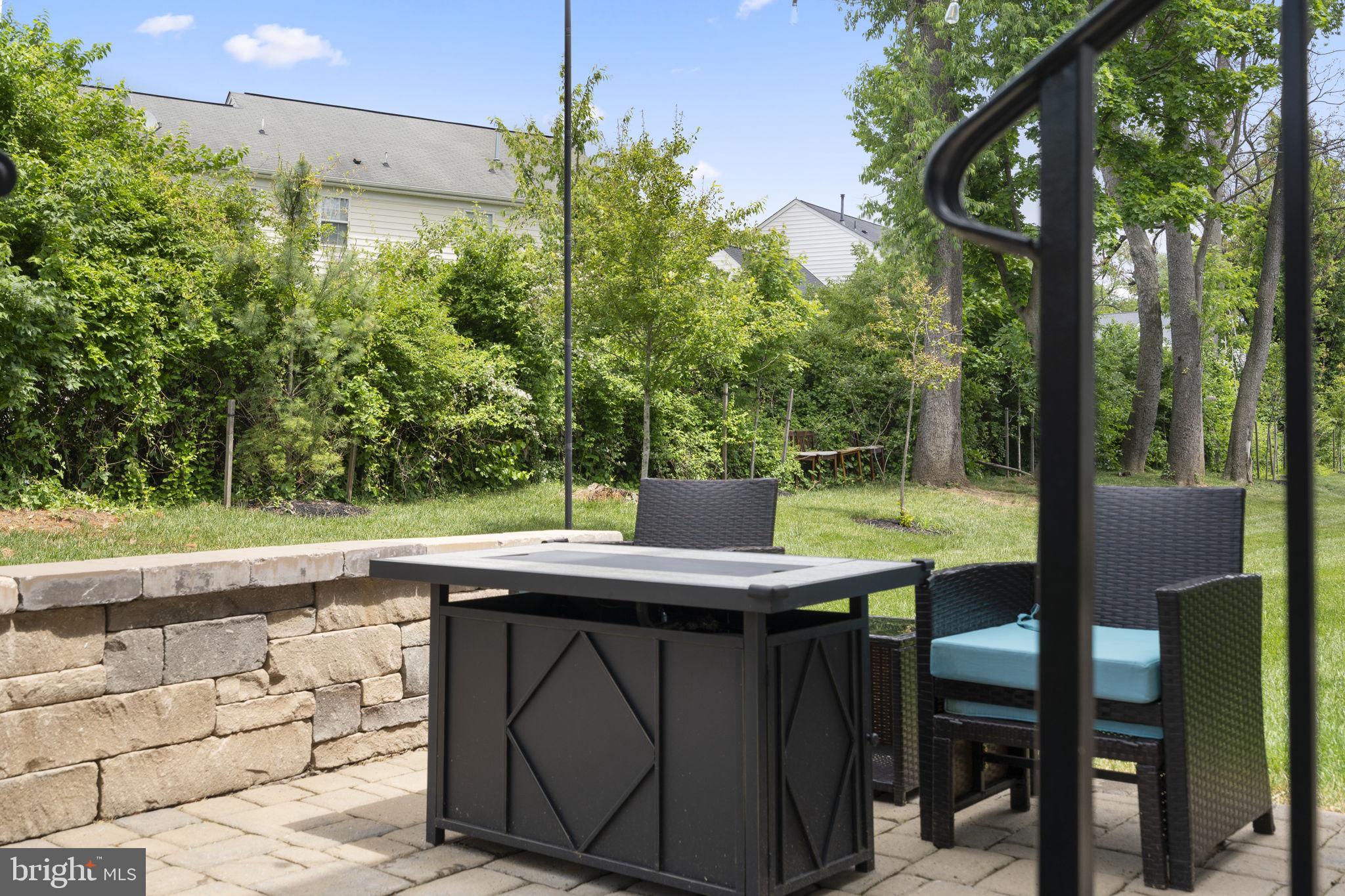 1713 Aurora Way Frederick, MD 21702 - Photo 52 of 57 a view of backyard with a table and chairs and potted plants