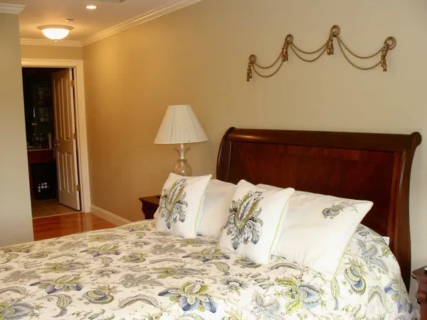 a bed room with a bed and a night stand