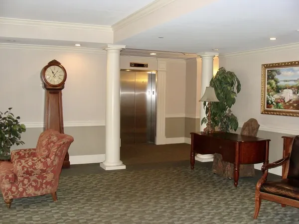 a view of a livingroom with furniture and a chandelier