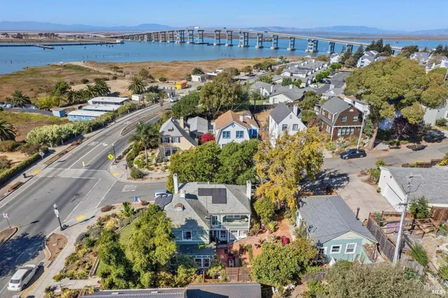 an aerial view of residential building and lake