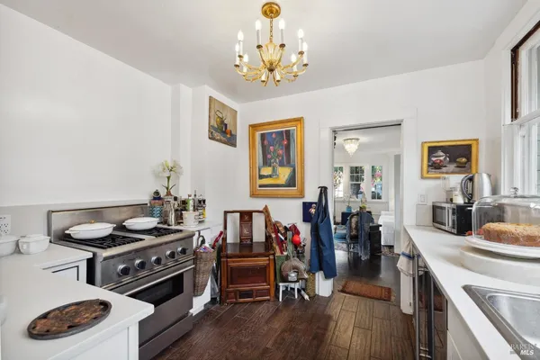 a kitchen with stainless steel appliances granite countertop a stove and cabinets