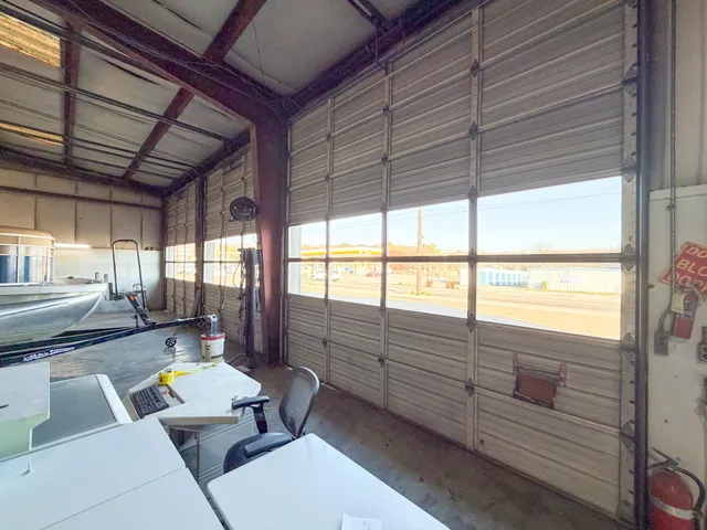 a view of a room with wooden furniture