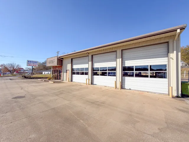 a view of building with car parked