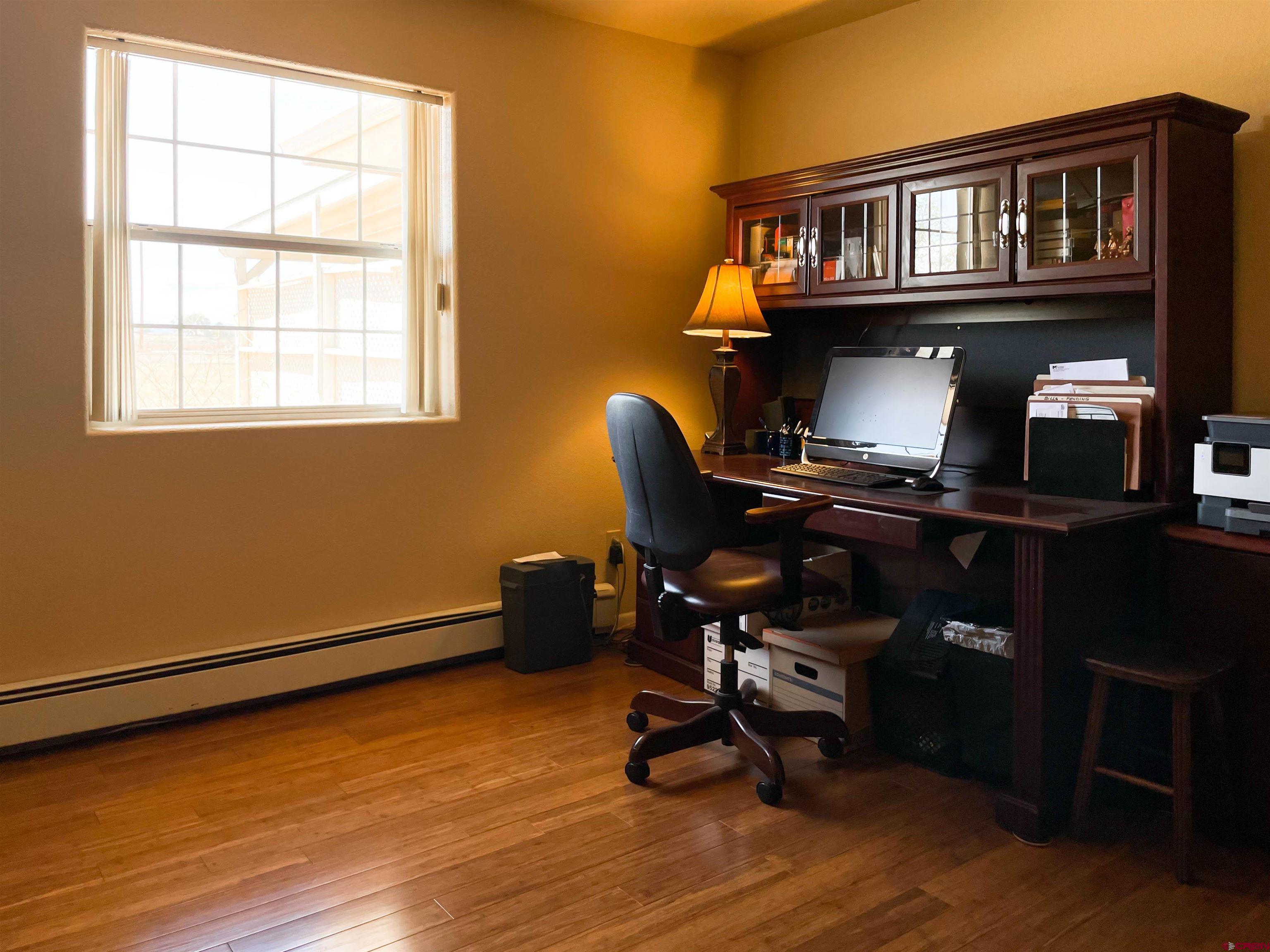 2535 1585 Road Delta, CO 81416 - Photo 20 of 35 a view of a workspace with furniture and a window