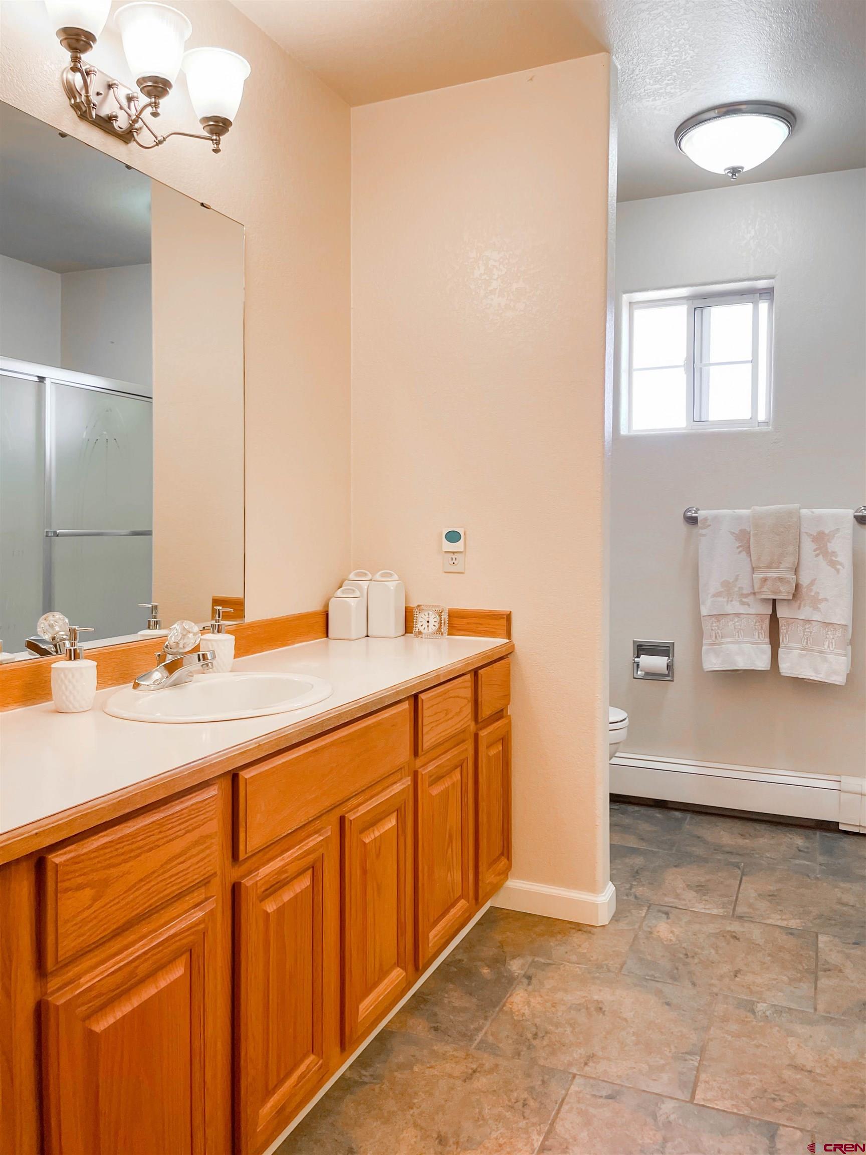 2535 1585 Road Delta, CO 81416 - Photo 21 of 35 a bathroom with a sink and a mirror
