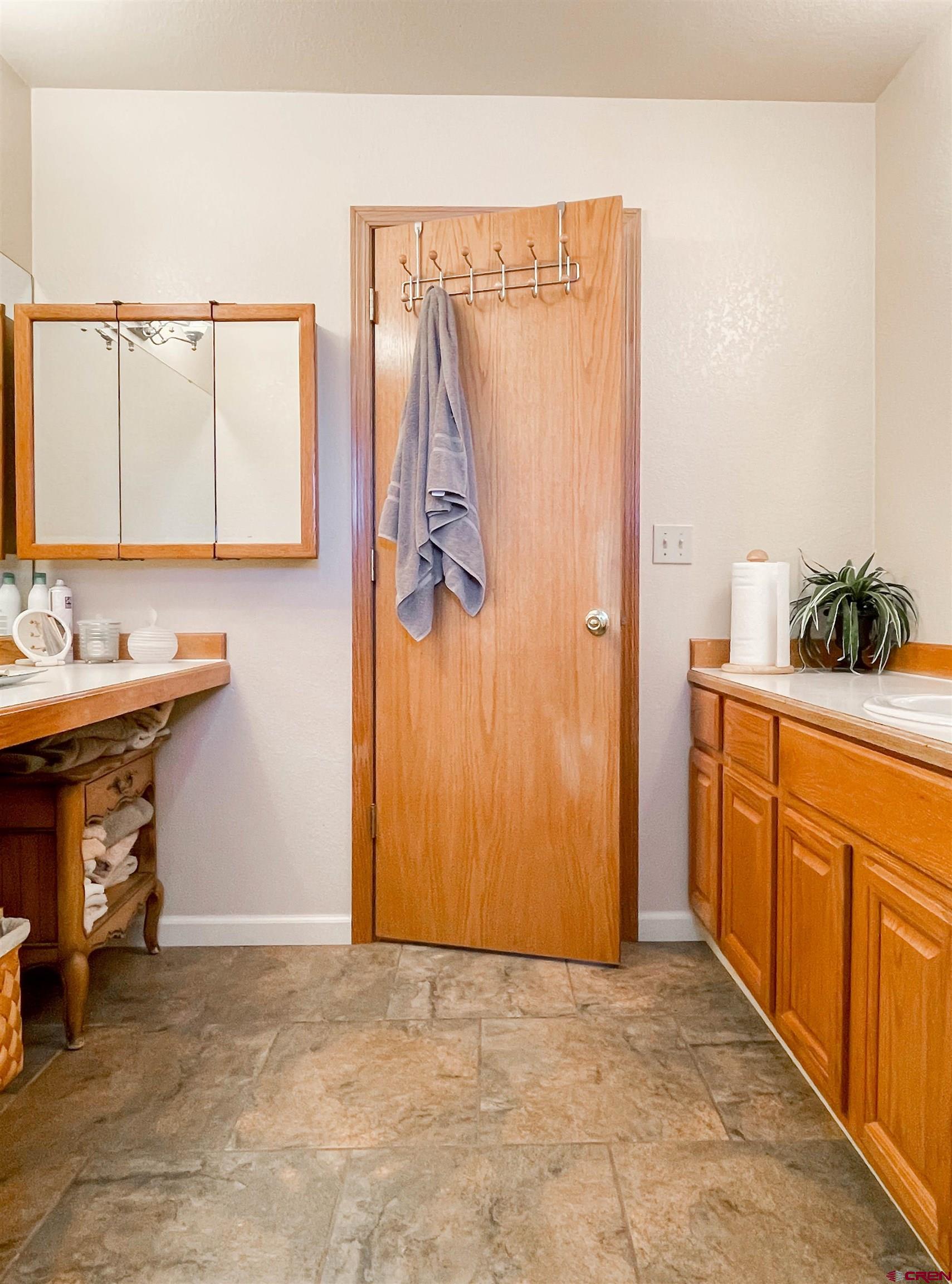 2535 1585 Road Delta, CO 81416 - Photo 23 of 35 a bathroom with a sink and a mirror