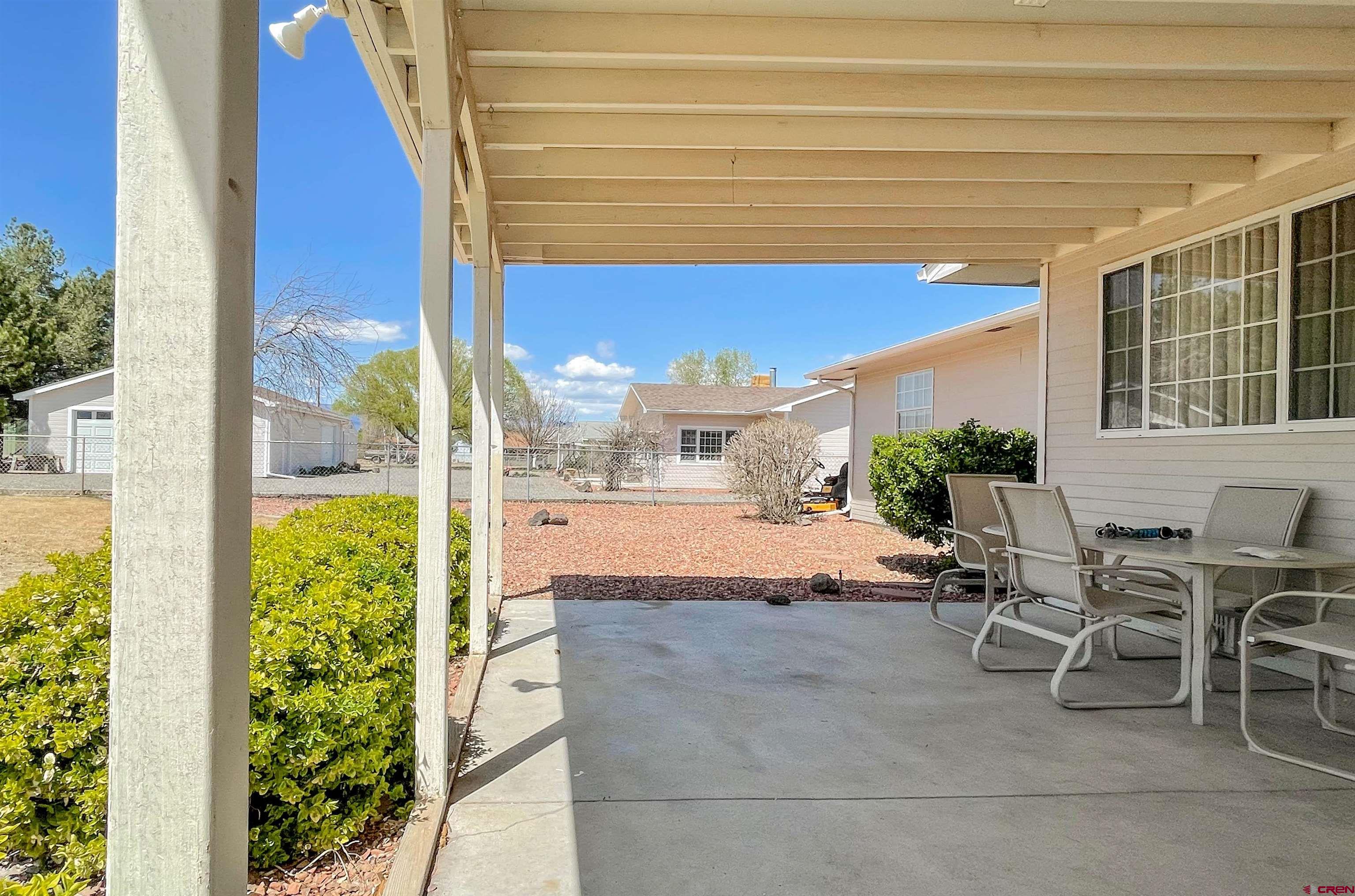 2535 1585 Road Delta, CO 81416 - Photo 27 of 35 a view of pool with lawn chairs and plants
