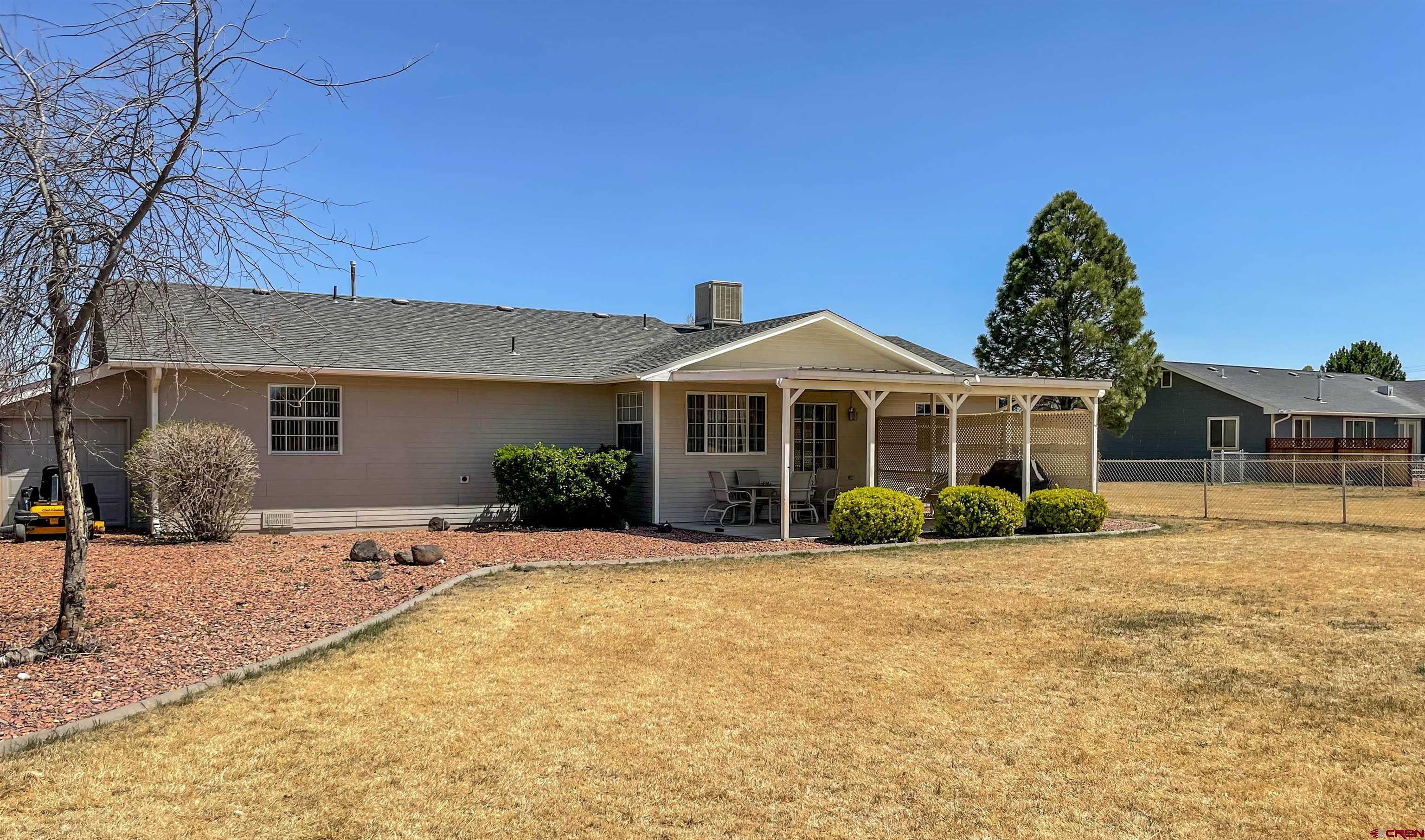 2535 1585 Road Delta, CO 81416 - Photo 29 of 35 a front view of a house with a yard